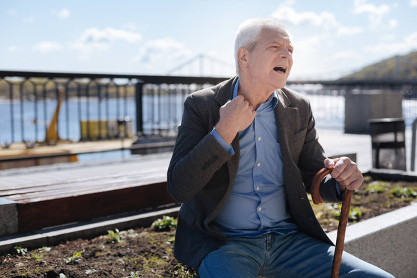 Retired man gasping on the promenade - Φωτογραφία, εικόνα