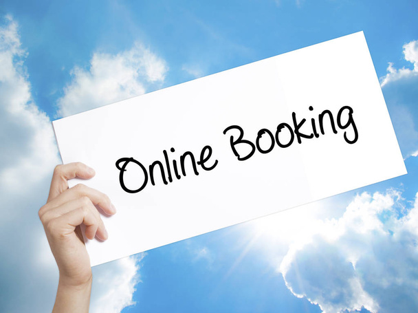  Online Booking Regístrate en white paper. Hombre de mano sosteniendo papel ingenio
 - Foto, Imagen