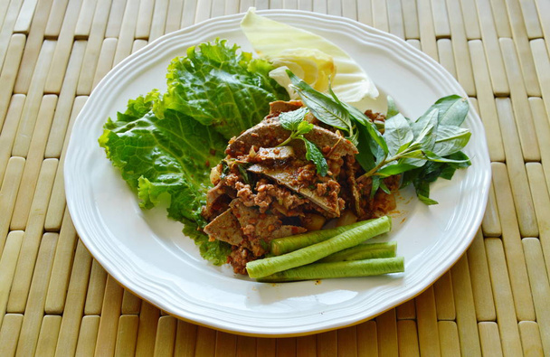 https://cdn.create.vista.com/api/media/small/153623906/stock-photo-spicy-chop-pork-and-liver-salad-eat-couple-with-fresh-vegetable-on-plate