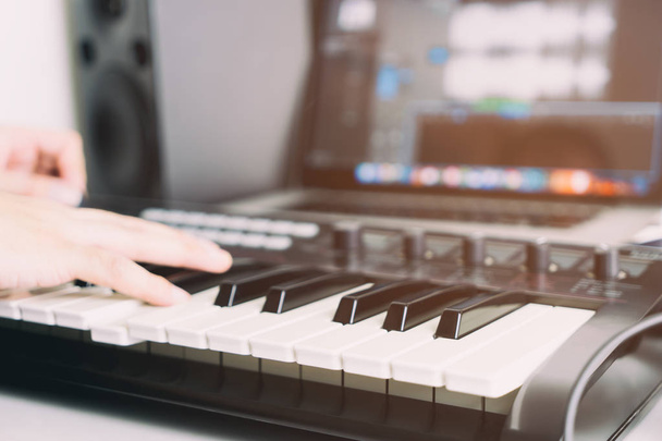 Keyboard player is recording song in home studio - Fotografie, Obrázek