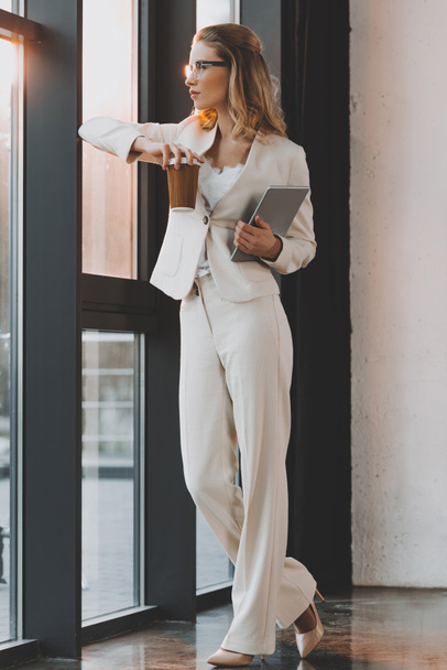pensive businesswoman with digital tablet - Photo, Image
