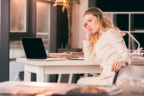 thoughtful businesswoman sitting in office - Photo, Image
