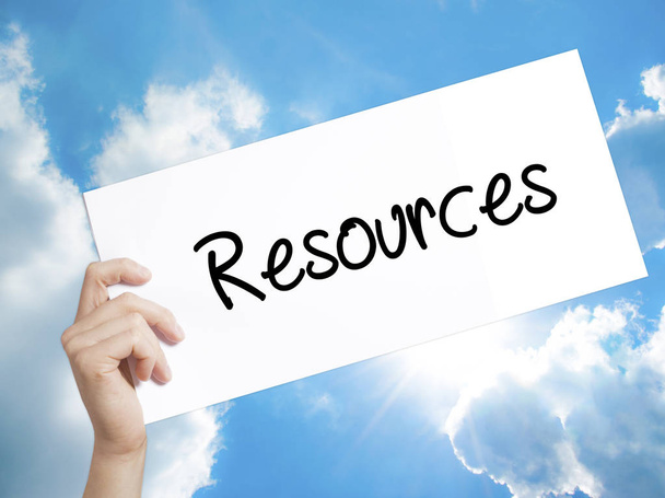 Resources Sign on white paper. Man Hand Holding Paper with text. - Photo, Image
