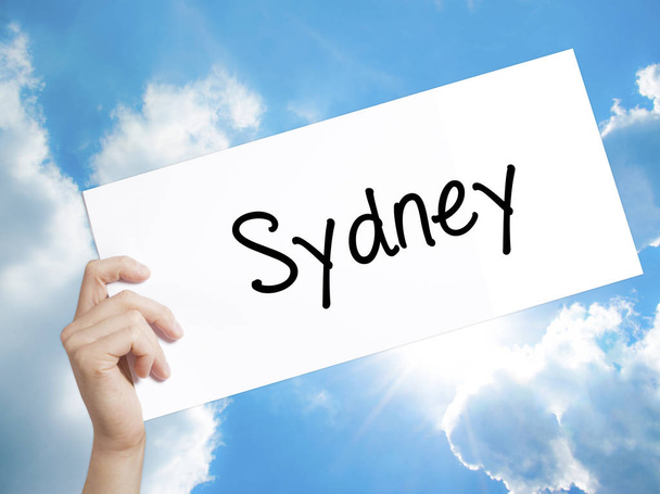 Sydney  Sign on white paper. Man Hand Holding Paper with text. I - Photo, Image