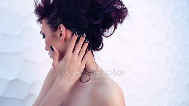 beautiful woman touches her neck by  hand - Felvétel, videó