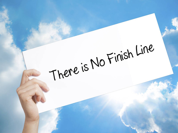 There is No Finish Line Sign on white paper. Man Hand Holding Pa - Photo, Image