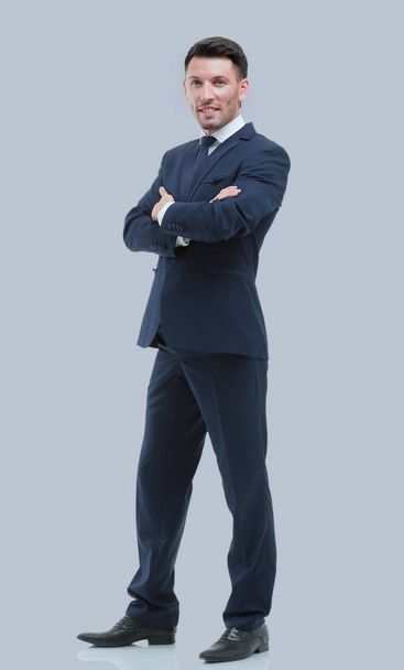 Handsome young businessman isolated on gray - Zdjęcie, obraz