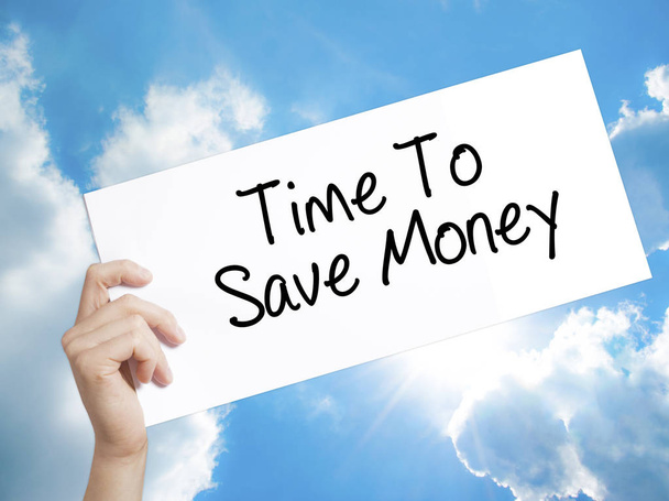 Time To Save Money  Sign on white paper. Man Hand Holding Paper  - Photo, Image
