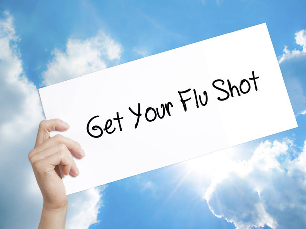 Obtenha o seu sinal de vacina contra a gripe no white paper. Homem mão segurando papel wi
 - Foto, Imagem