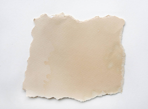 Brown torn paper on white background - Foto, imagen