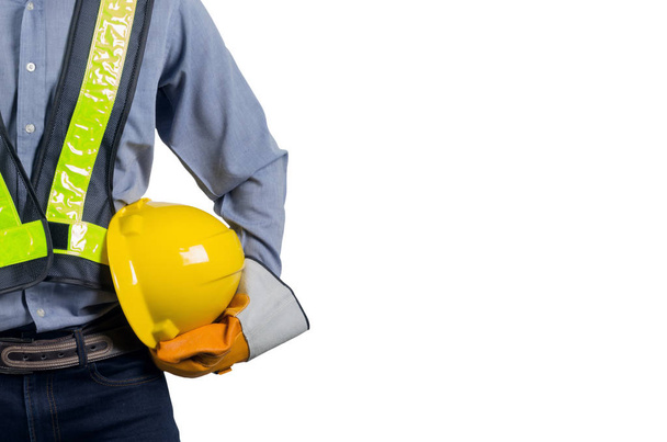 Engineer holding yellow helmet - Photo, Image