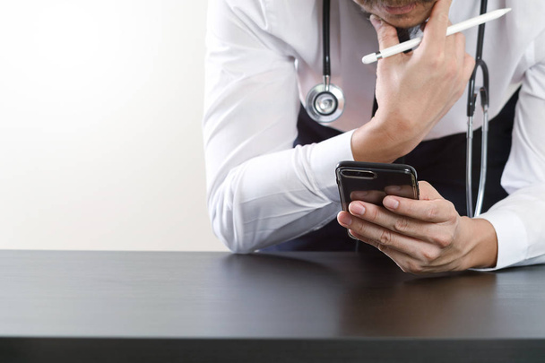 close up of smart medical doctor working with smart phone and st - Photo, Image