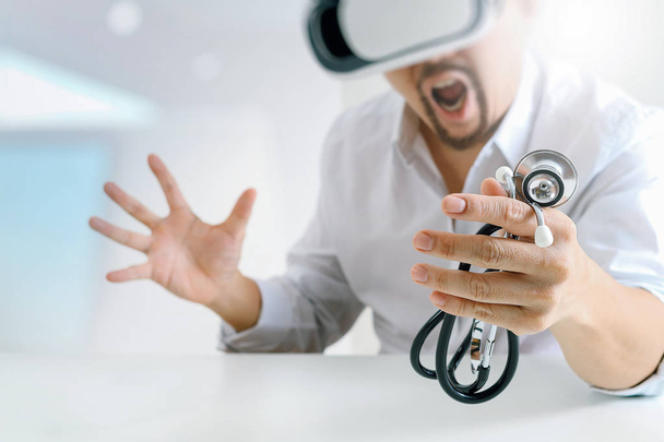 smart doctor wearing virtual reality goggles in modern office wi - Photo, Image