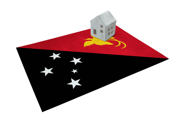 Small house on a flag - Papua New Guinea - Photo, Image