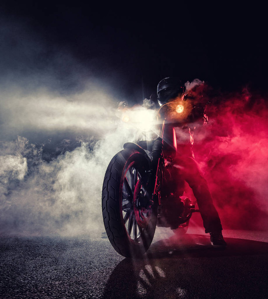 High power motorcycle chopper with man rider at night - Zdjęcie, obraz