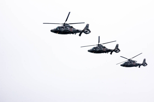 Three military navy helicopters flying in row - Photo, Image