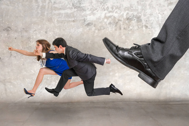 Small business woman and man together running away - Foto, Imagen