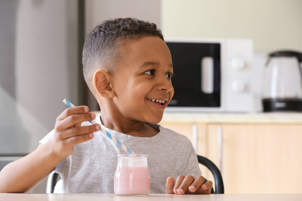 African American boy drinking yogurt - 写真・画像