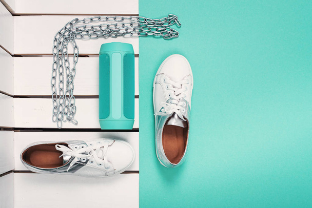 Flat Lay of Modern White Shoes. Overhead Top View Photography. Youth Lifestyle Concept. Turquoise background - Photo, Image
