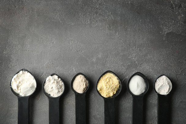 Spoons with different types of flour  - Fotó, kép