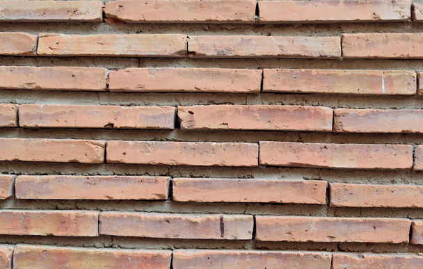 Wall of narrow old brick, background - 写真・画像