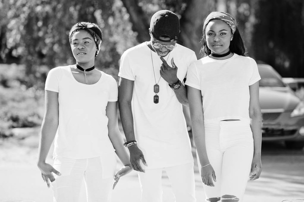 Three stylish african american friends, wear on white clothes ag - Fotografie, Obrázek