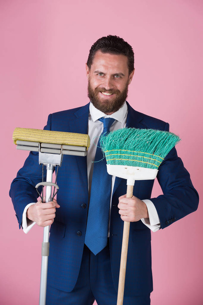 businessman or man with happy face, broom in business outfit - Foto, Bild