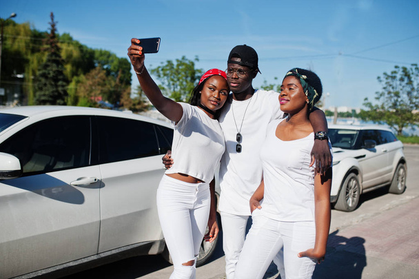 Three stylish african american friends making selfie on phone, w - Φωτογραφία, εικόνα