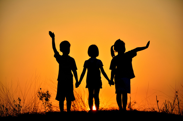  silhouette of three children - Foto, Imagem