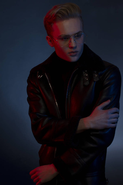 Young handsome sexy man in leather jacket and glasses. - Foto, Imagem