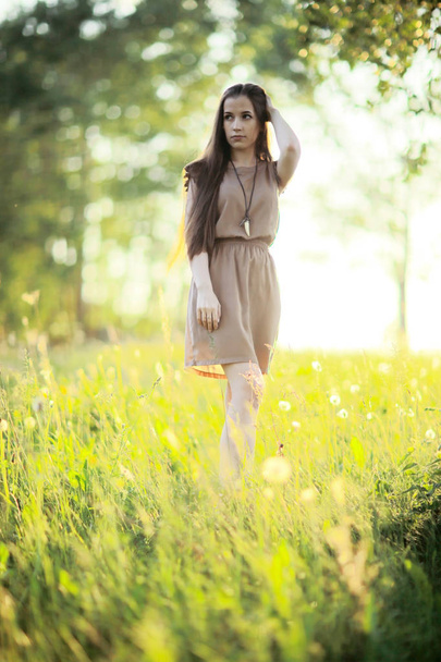 young woman in picturesque field - Foto, Bild