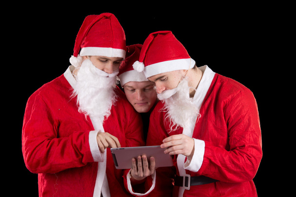 Tres Santa Claus.
 - Foto, imagen