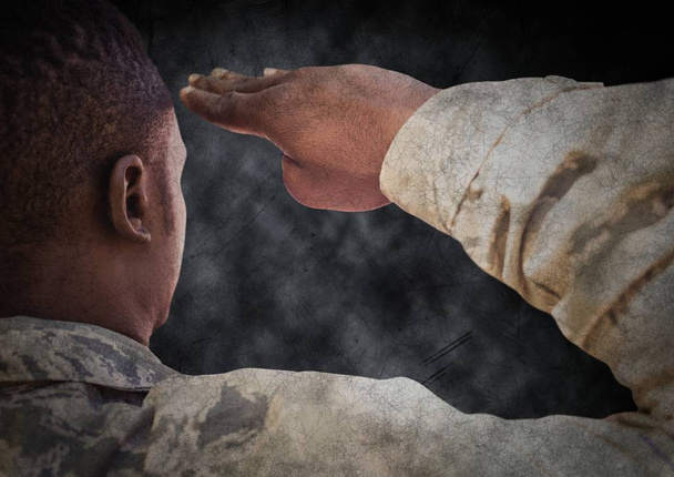 Back of soldier saluting with black grunge background and overlay - Fotografie, Obrázek