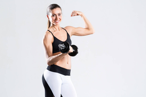 Fitness woman with dumbbells isolated. - Foto, immagini