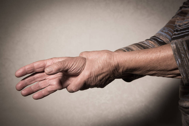 Hand of Senior Woman Massaging Wrist - Foto, immagini