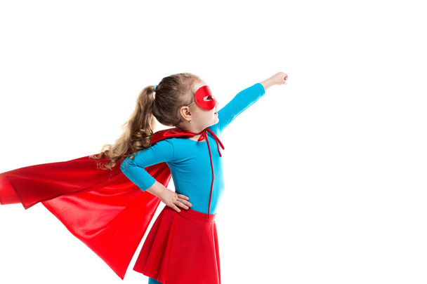 Little girl superhero in a red cloak and mask isolated on white background. - Zdjęcie, obraz