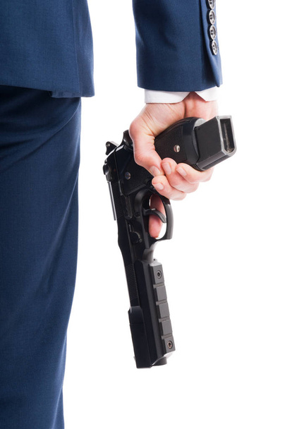 Secret agent hand in closeup with rifle - Zdjęcie, obraz