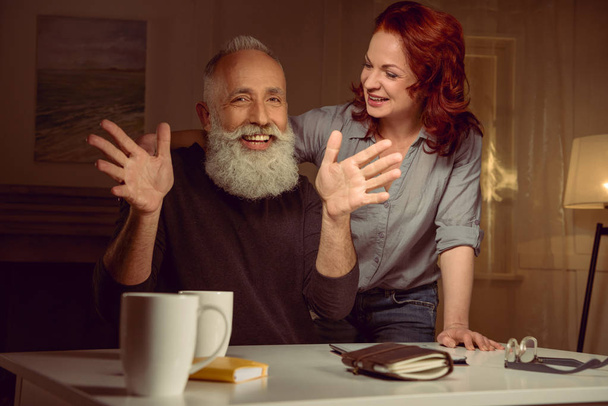 red hair woman with mature man - 写真・画像