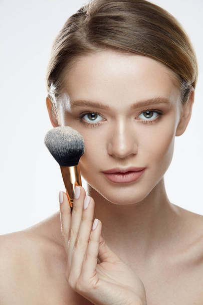 Cosmetics. Portrait Of Sexy Girl Holding Cosmetic Powder Brush - Photo, Image