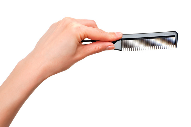Comb in the hand - Photo, image