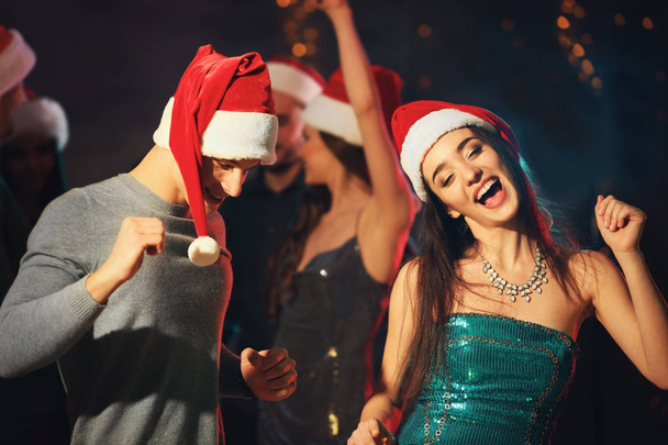 Friends at Christmas party in night club - Foto, Imagem