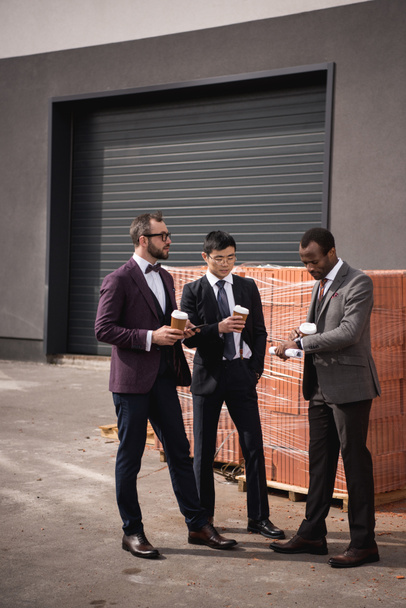 young multiethnic businessmen in formalwear meeting at coffee break outdoors, business team meeting - Photo, Image