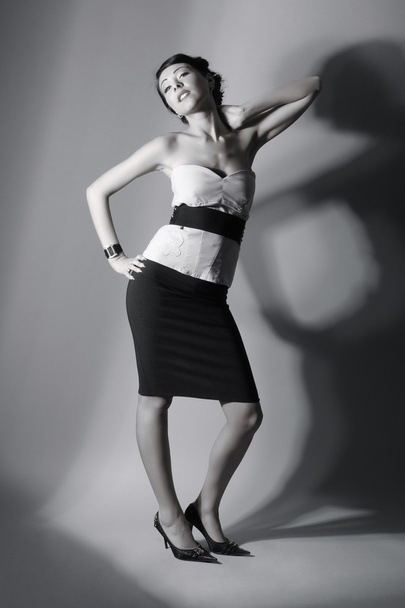 Fashion shoot of young sexy lady over grey background - Foto, Imagem