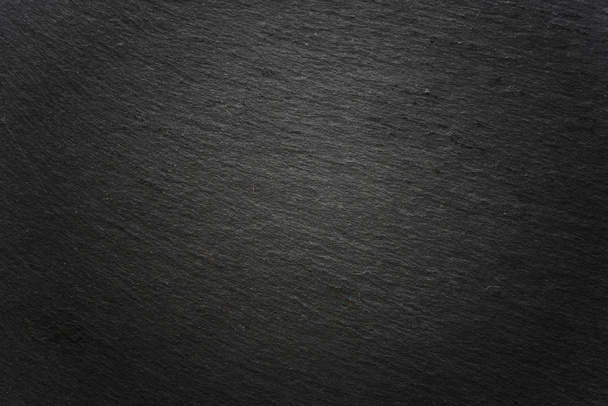 vignetted dark gray slate surface background - Zdjęcie, obraz