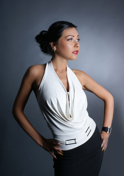 Fashion shoot of young sexy lady over grey background - Photo, image