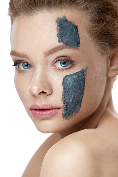 Cosmetic Treatment. Portrait Of Beautiful Woman With Clay Mask - Valokuva, kuva