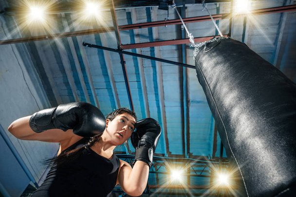 The female boxer training at gym - Фото, изображение