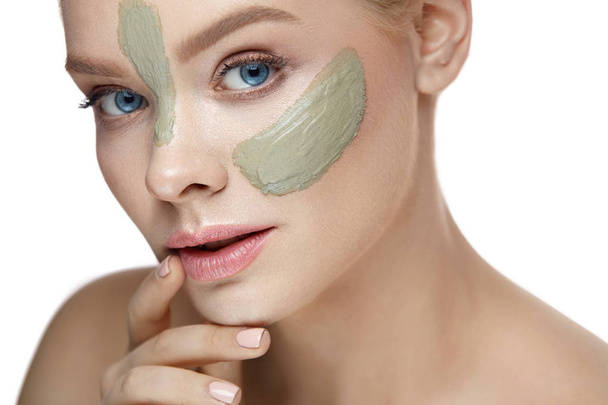 Beauty Cosmetics. Woman With Clay Mask Stripes On Facial Skin - Foto, Bild