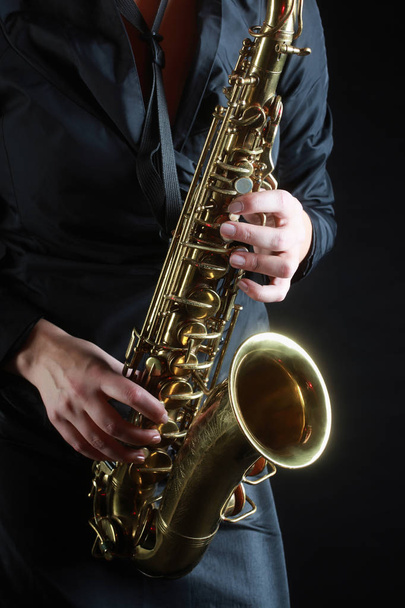 Saxophone Player Saxophonist playing jazz music. Sax alto - 写真・画像