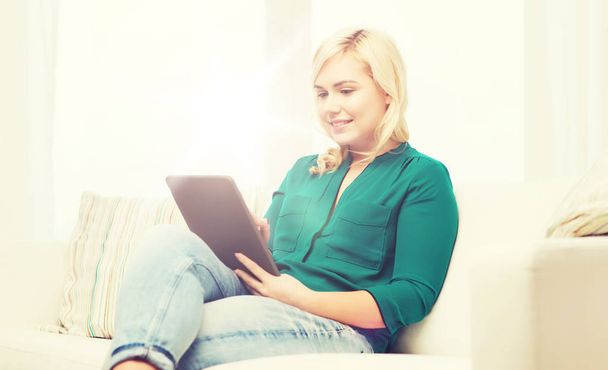 smiling woman with tablet pc at home - Photo, Image